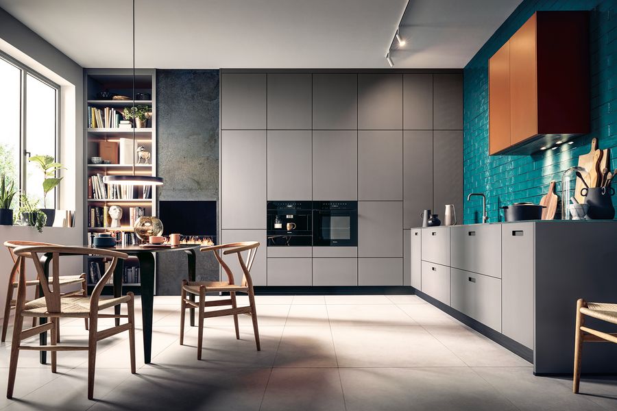 Graue, moderne L-Küche mit Esstisch